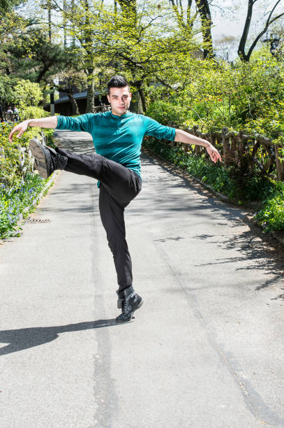 istock Young man dancing outdoors in Park in New York City 1333443789