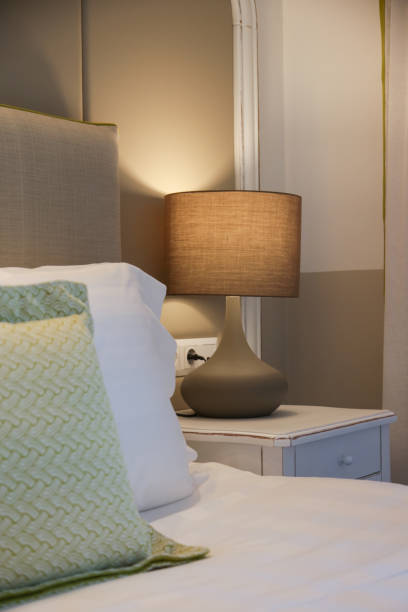 istock Cozy and elegant bedroom. King size bed with bedside lamp. 1333444584