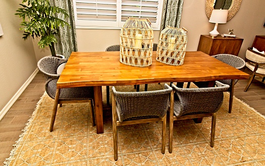 Dining Area Wooden Table And Six Wicker Chairs