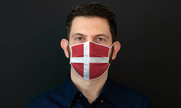 istock Man wearing Danish flag protective medical face mask. 1333444774