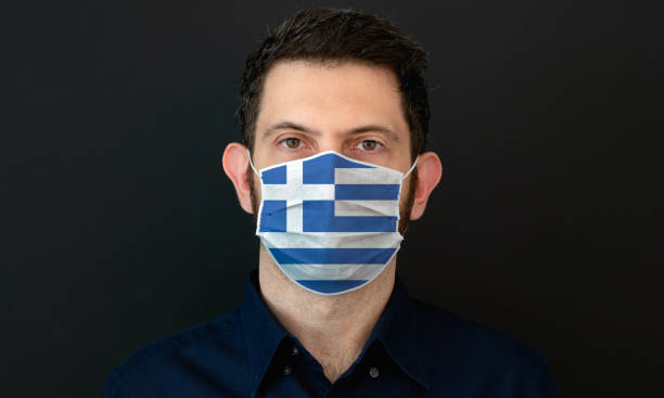 istock Man wearing Greek flag protective medical face mask. 1333445721