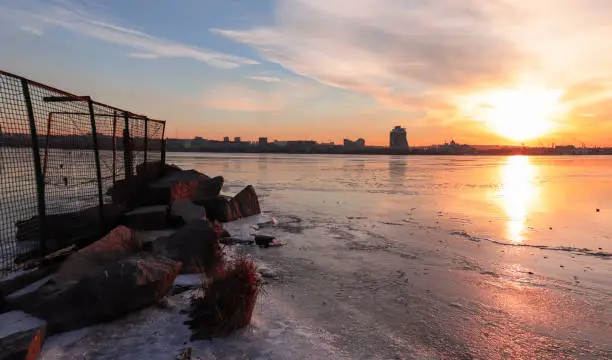 Photo of Winter, cold sunset on the Dnieper River overlooking the right bank of the city.