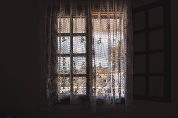istock View outside from Greek house window with curtains 1333448590