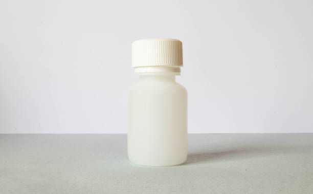 istock white pill jar on a light background, medical concept 1333448983