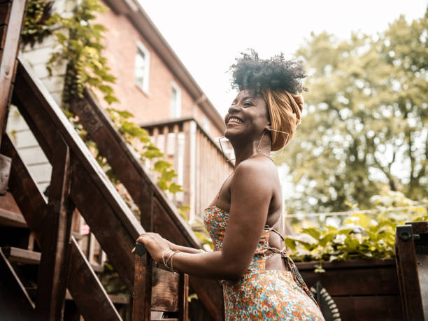 istock Young African woman relaxing in back yard 1333448998