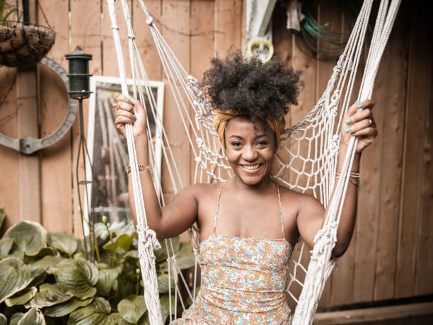 istock Young African woman relaxing in back yard 1333449646