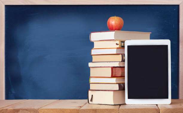 istock Education background with books and digital tablet 1333452621