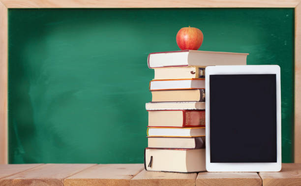 istock Education background with books and digital tablet 1333452623