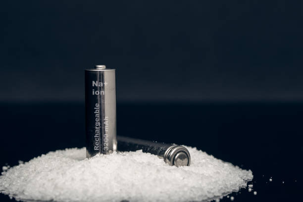 two rechargeable sodium ion batteries on a bunch of salt new cheaper and efficient energy cells sodium stock pictures, royalty-free photos & images
