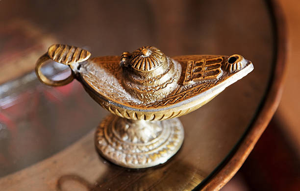 Alladin Genie Oil Lamp On Circular Glass Table Stock Photo - Download Image  Now - Copy Space, Decoration, Engraving - iStock