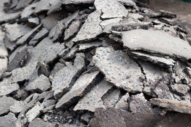 istock Broken asphalt. Pieces of an asphalt road. 1333456024