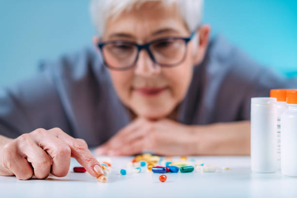 istock Senior patient counting pills. Medicine non-adherence. 1333457109
