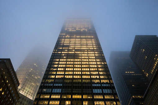 Low fog covering the parts of midtown Manhattan skyscrapers in New York City.