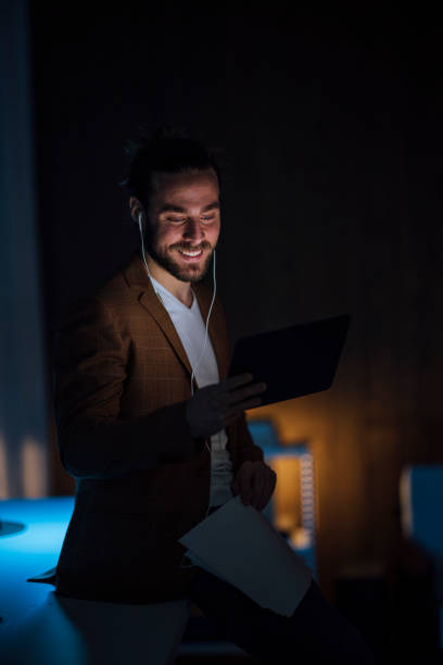 istock Handsome Young Businessman is Having a Video Call Working Late at the Office 1333458178