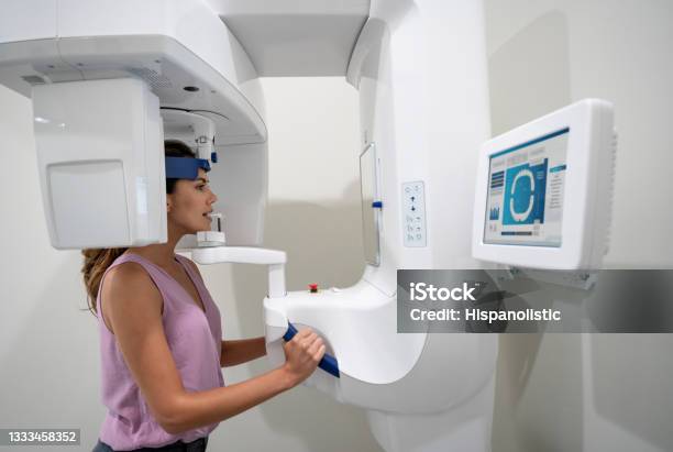 Woman Getting An Xray Of Her Teeth At A Dental Clinic Stock Photo - Download Image Now