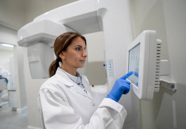 istock Radiologist operating an x-ray machine at the hospital 1333458354