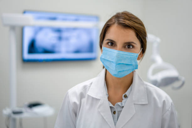 istock Dentist wearing a facemask at her practice during the COVID-19 pandemic 1333458377