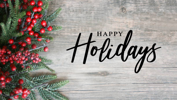 istock Happy Holidays Text with Holiday Evergreen Branches and Red Berries Over Rustic Wood Background 1333471675
