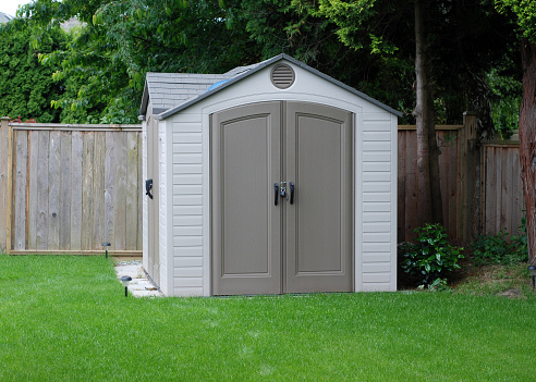 Looking out at a mass produced, generic backyard shed.