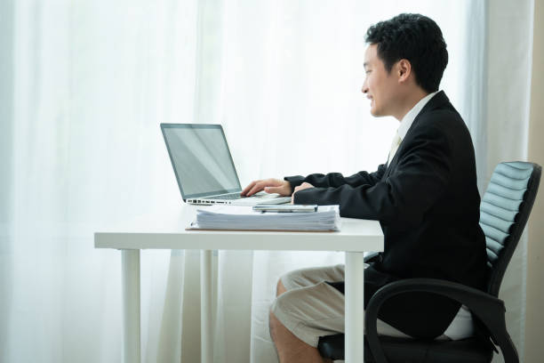 istock Asian businessman working at home. 1333492774