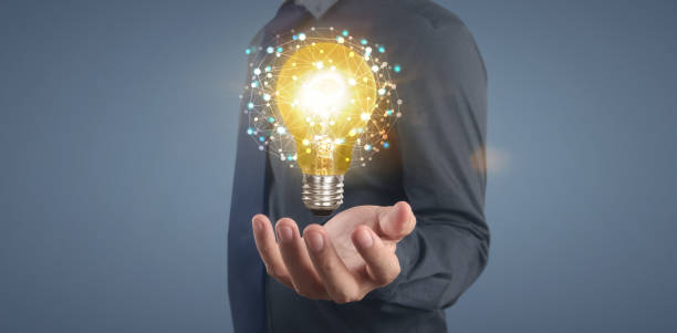 istock Hand of holding illuminated light bulb,  innovation inspiration concept 1333497940