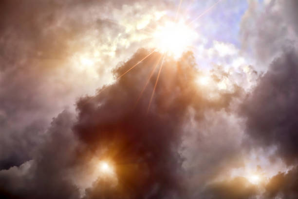istock Dramatic sky and dark storm clouds with sunbeams 1333498638