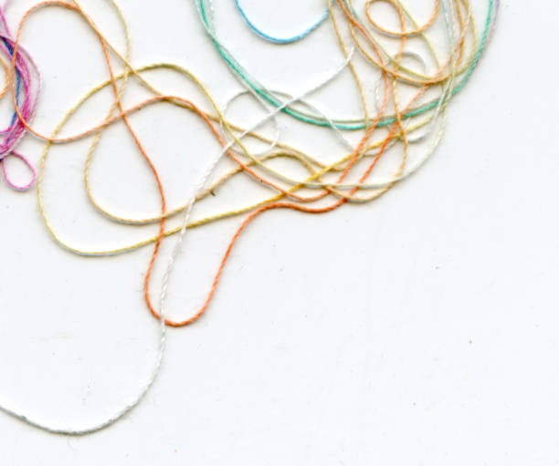 istock Multicolor tangled color needlecraft silk cord. Abstract color background, in white background 1333499990