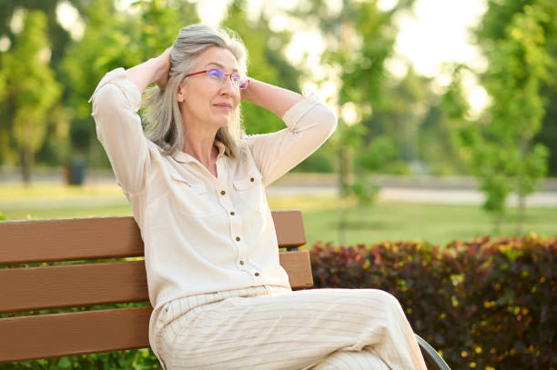 istock Calm woman resting on park bench 1333500903