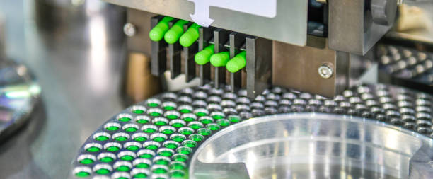 istock Green capsule medicine pill production line 1333501748
