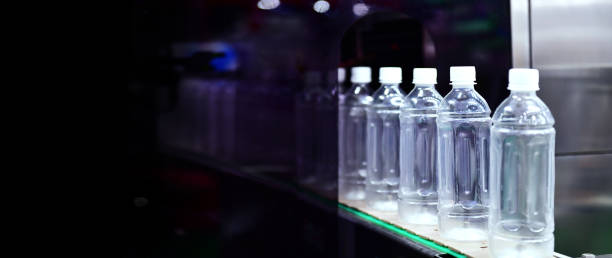 istock Clear plastic Bottles transfer on Automated conveyor systems industrial automation for package 1333501775
