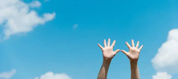 Photo of Woman palms under blue sky