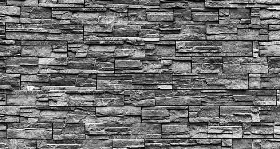 Backgrounds of black stone wall