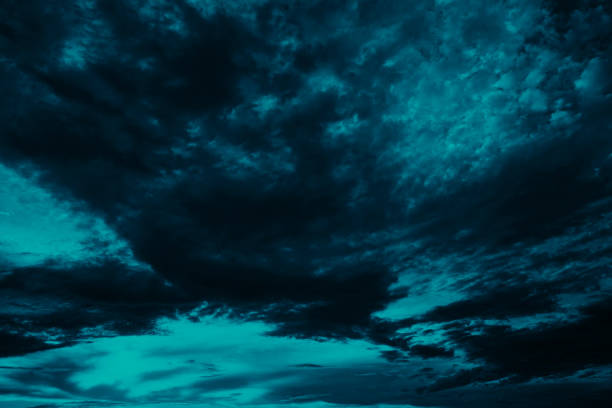 istock Toned blue green night sky with clouds. Dark teal sky background with copy space for design. 1333504984