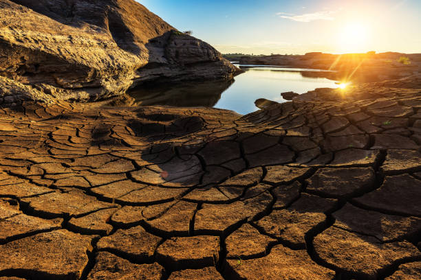 istock Land with dry and cracked ground. Desert,Global warming background 1333505567