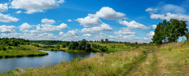 istock Summer sunny rural landscape with river and green hills. 1333508457