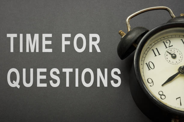 istock Time for questions words and old alarm clocks. 1333508510