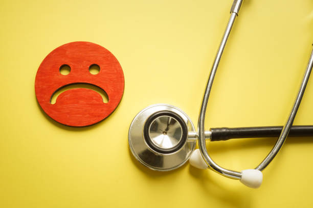 istock Bad patient satisfaction concept. Stethoscope and sad unhappy face. 1333508552
