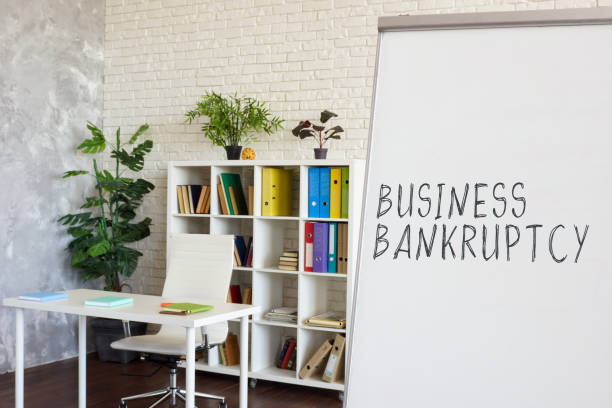 istock Empty office and words Business bankruptcy on the whiteboard. 1333508619