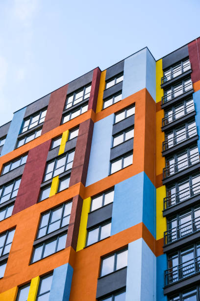 istock Modern building angle and windows. Multistory new multicolored apartment building. Stylish living block of flats. Bright juicy colors in the construction of buildings 1333510493