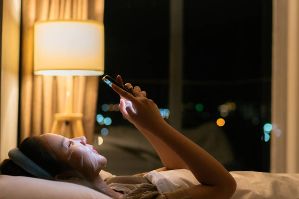 istock Woman using phone to cure boredom while waiting for a face mask. 1333510570