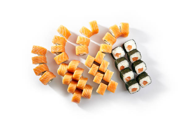 istock Sushi Rolls Set with Various Salmon Maki Rolls. Maki sushi rolls on white background. 1333511566