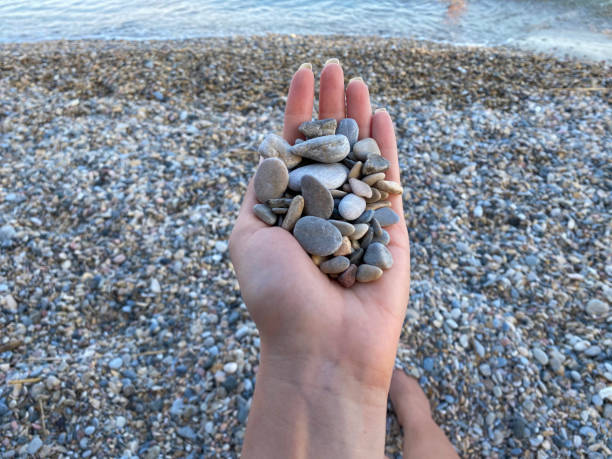 istock Hands holding pile of stones 1333512550