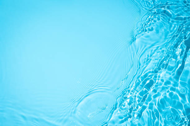 istock transparent blue colored clear calm water surface texture 1333512660