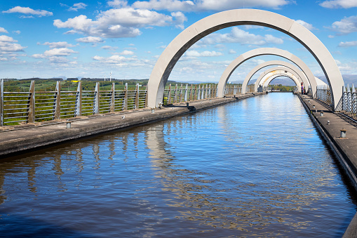 The Falkirk Wheel, a rotating boat lift connecting the Forth and Clyde Canal with the Union Canal. It opened in 2002