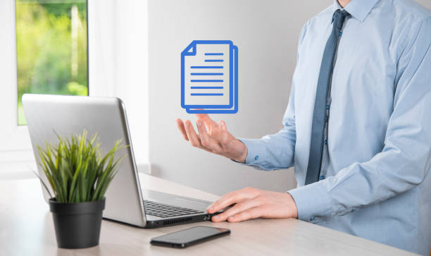istock Businessman man holding a document icon in his hand Document Management Data System Business Internet Technology Concept. Corporate data management system DMS 1333514555