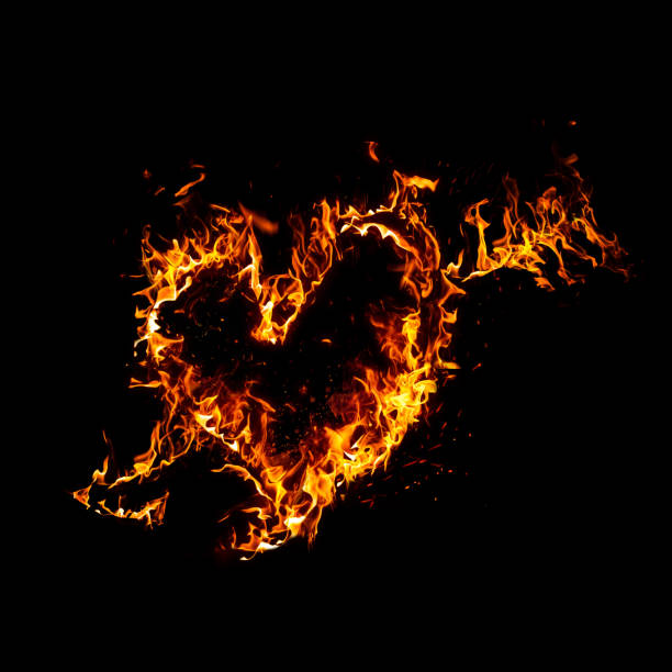 istock Shape of heart made by blazing fire flame isolated on black background 1333514675