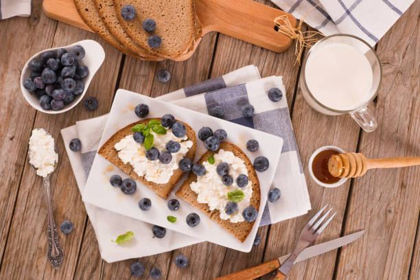 istock Rye bread with cottage cheese, blueberries and honey. 1333516804