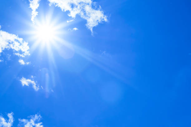 istock Bright sun with beautiful beams in the sky with light clouds 1333518031