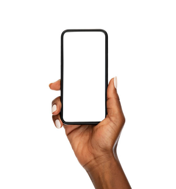black woman hand holding modern smart phone isolated on white background - woman phone stockfoto's en -beelden