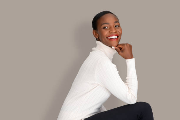 istock Stylish black woman sitting with turtle neck sweater 1333518151